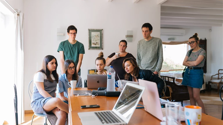 Group of People Watching on Laptop